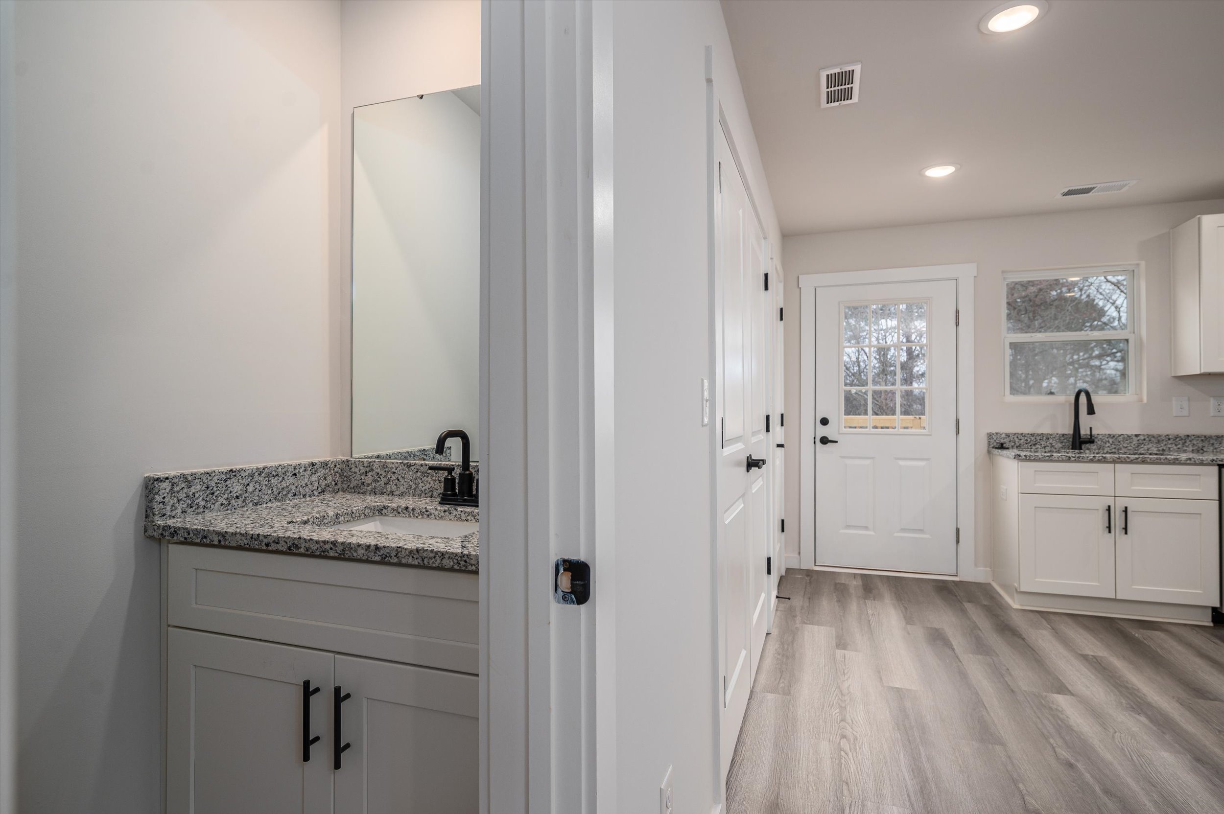 Open-plan living room and kitchen inside a Legacy Signature Rentals townhome